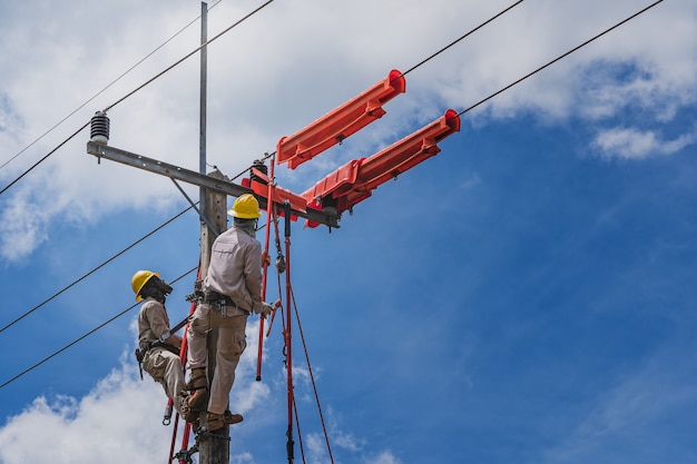 Premium Photo | The lineman used tie stick to carve the tie wire used ...