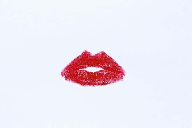 Premium Photo | Lip imprint with red lipstick on white background