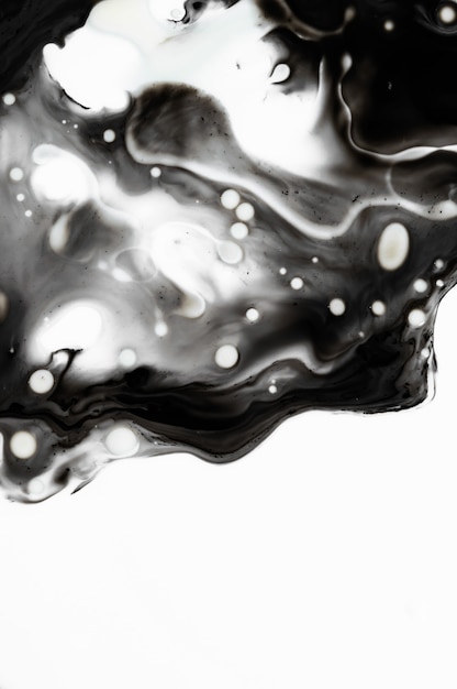 Premium Photo Liquid black ink in water. marble art