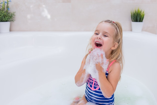 Little Blonde Girl Taking Bubble Bath In Beautiful Bathroom Kids