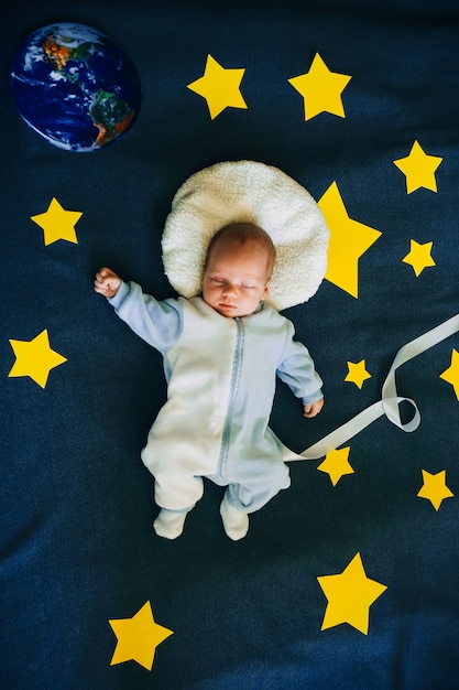 Premium Photo Little Boy Baby Sleeping In A Suit Of The Astronaut Of The Starry Sky