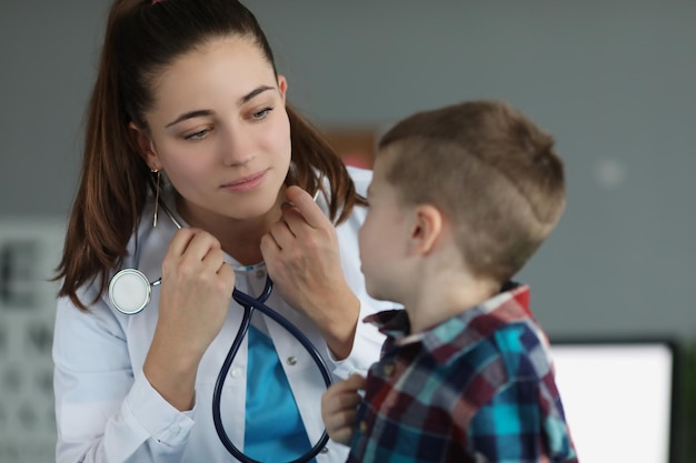 Premium Photo | Little boy sitting on doctor appointment qualified ...