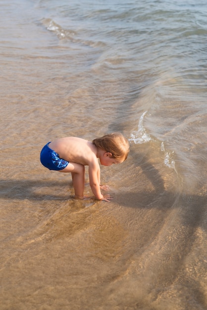 boy leg swimsuit by sea waves