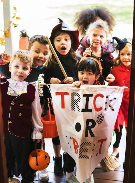 Free Photo | Little children trick or treating on halloween