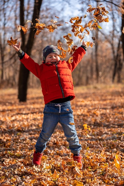 premium-photo-little-four-years-old-boy-play-in-the-autumn-park