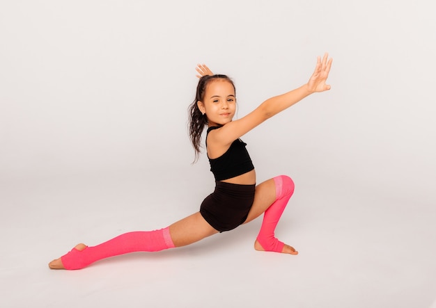 Premium Photo | Little girl gymnast on a white background. sport ...