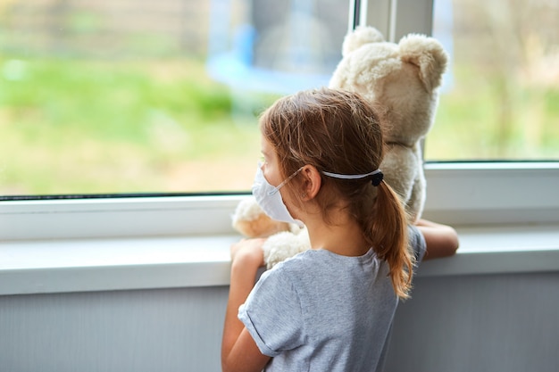 little girl holding a teddy bear