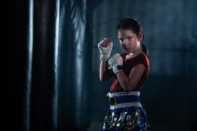 Premium Photo Little Girl Thai Boxing Training Is A Self Defense Course Muay Thai