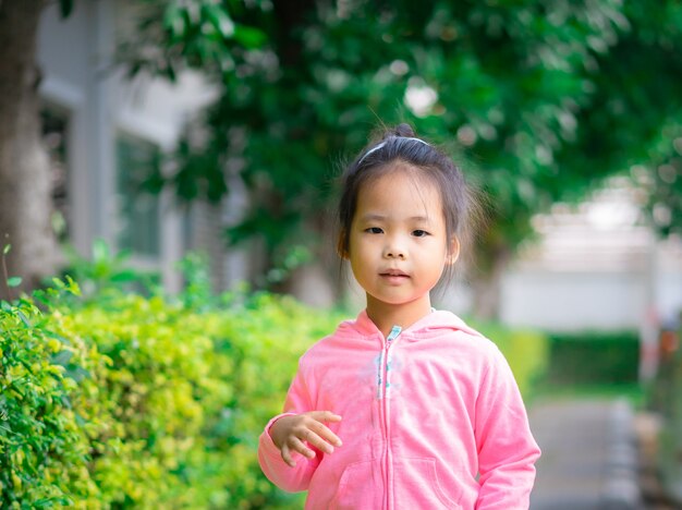 Premium Photo | Little girl wear jacket in the park
