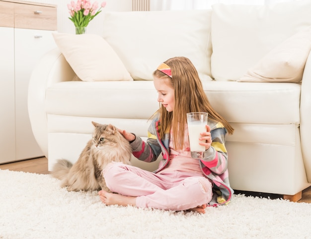 Premium Photo | Little girl with her cat