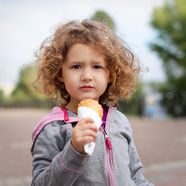 Premium Photo Little Girl With Icecream In The Park