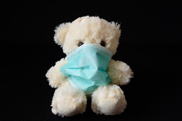 Premium Photo | Little teddy bear in a medical mask