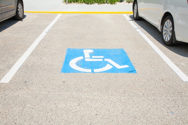 Premium Photo | Logos for disabled on parking. handicap parking place ...