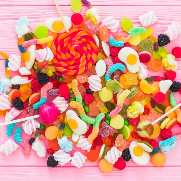 Free Photo | Lollipops on bunch of sweets