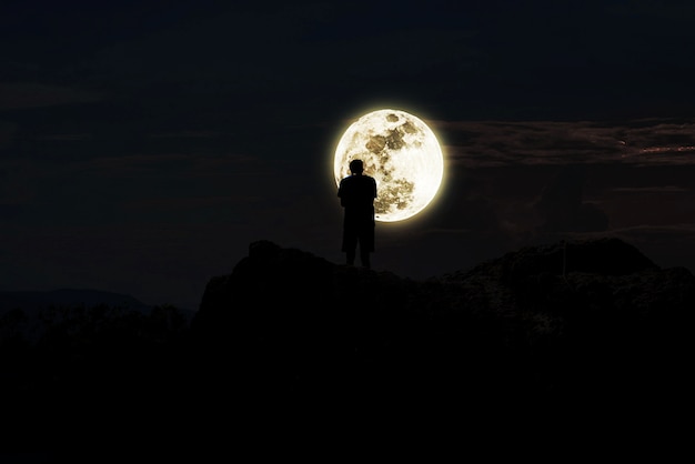 Premium Photo Lonely Man Standing On The Rock