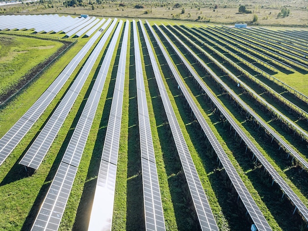 Premium Photo | Long solar panels in a field in a row. view from the ...