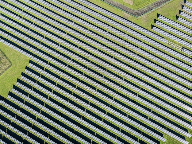 Premium Photo | Long solar panels in a row at bird's eye view. huge ...