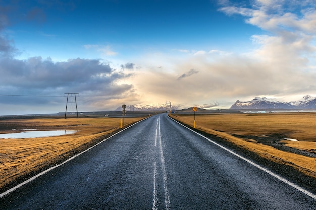 Free Photo | Long straight road and blue sky, iceland.