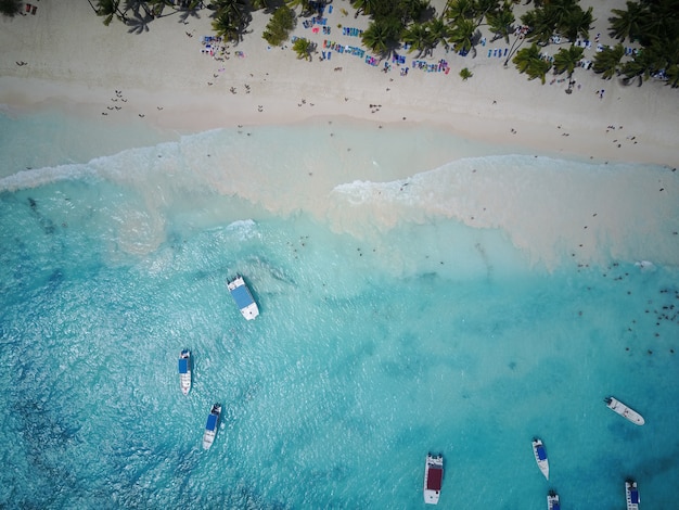 Look from above at turquoise water along golden beach somewhere in ...