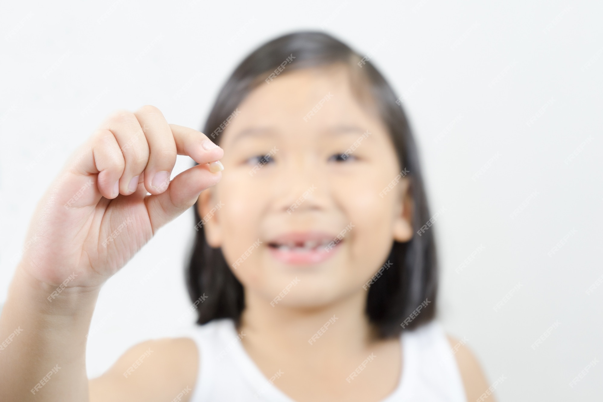 premium-photo-loss-of-a-baby-tooth