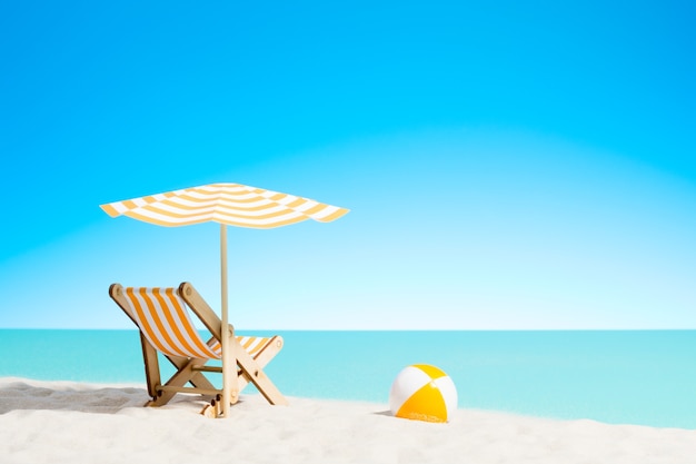 Premium Photo | Lounge chair with parasol and beach ball on the coast ...