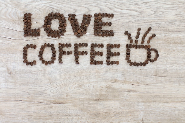 premium-photo-love-coffee-words-letters-made-from-coffee-beans-on