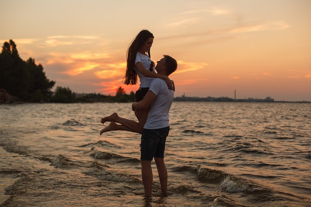 Premium Photo Love Story On The Beachyoung Beautiful Loving Couple Hugging On The Beach At Sunset 