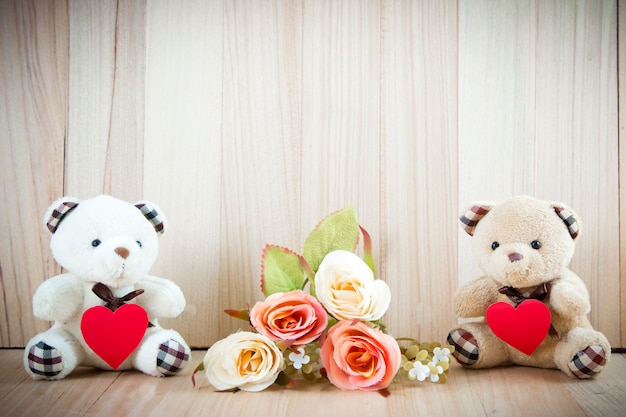 Premium Photo | Lovely couple bear sit near sweet roses on floor