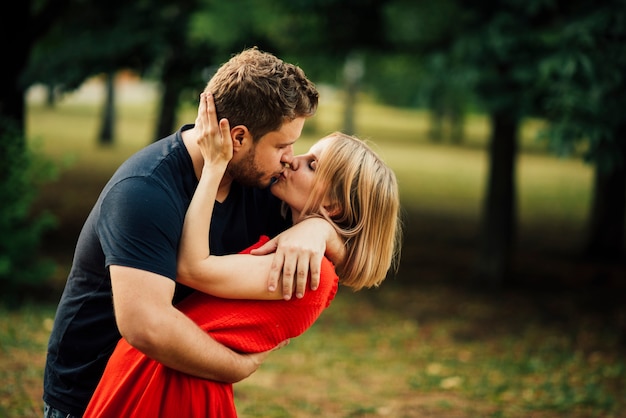 Lovely Couple Kissing Outdoors Photo Free Download 