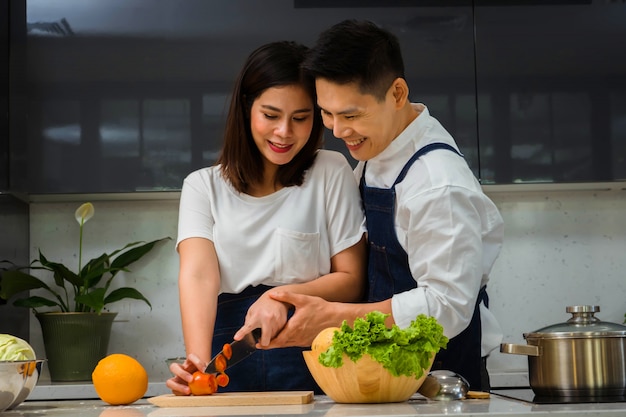 Premium Photo | Loving couple cooking in the kitchen.loving couple ...