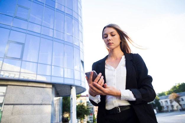 Low Angle Shot Woman Using A Phone Free Photo