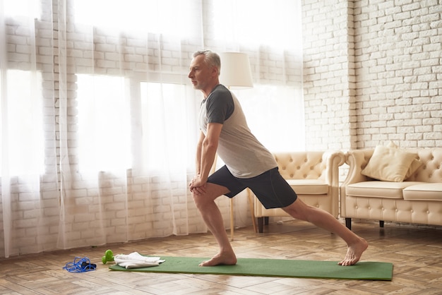 Premium Photo | Lunge exercises on mat leg muscles stretching.