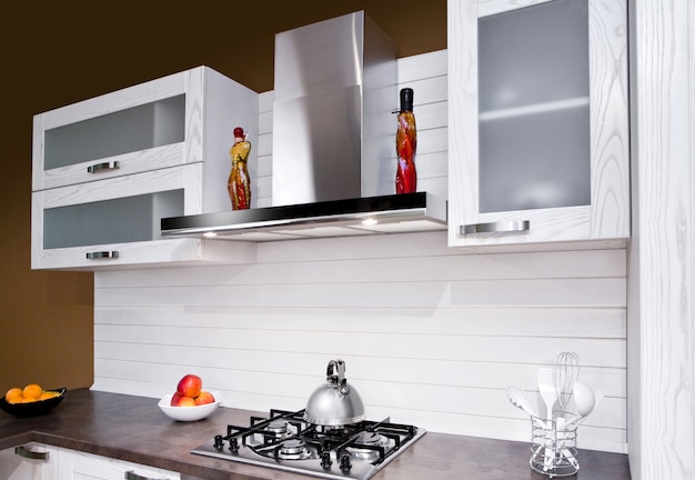 Luxurious new white kitchen with modern appliances ...