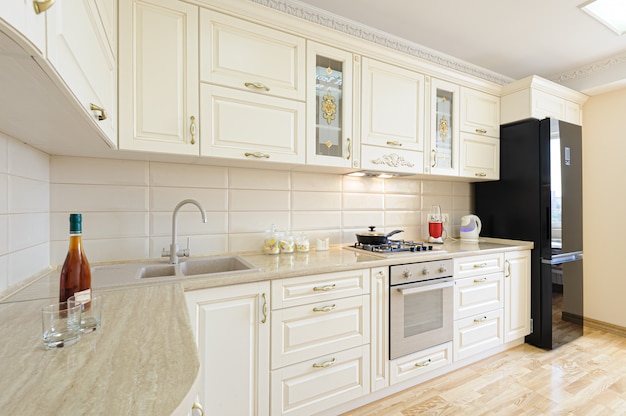 Luxury modern beige and white kitchen interior Premium Photo