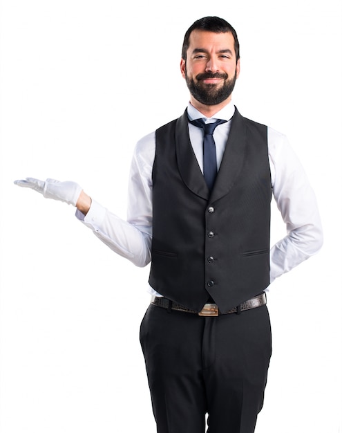 Download Free Photo | Luxury waiter holding something