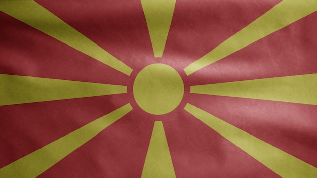 風に揺れるマケドニアの旗 滑らかなシルクを吹く北マケドニアのバナー 布生地のテクスチャは 背景をエンサインします プレミアム写真