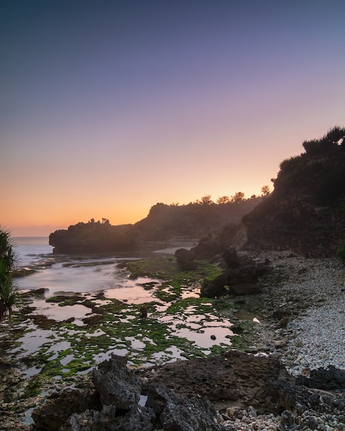 Premium Photo | Magical sunset at bluluk or mbluluk beach. new beach ...