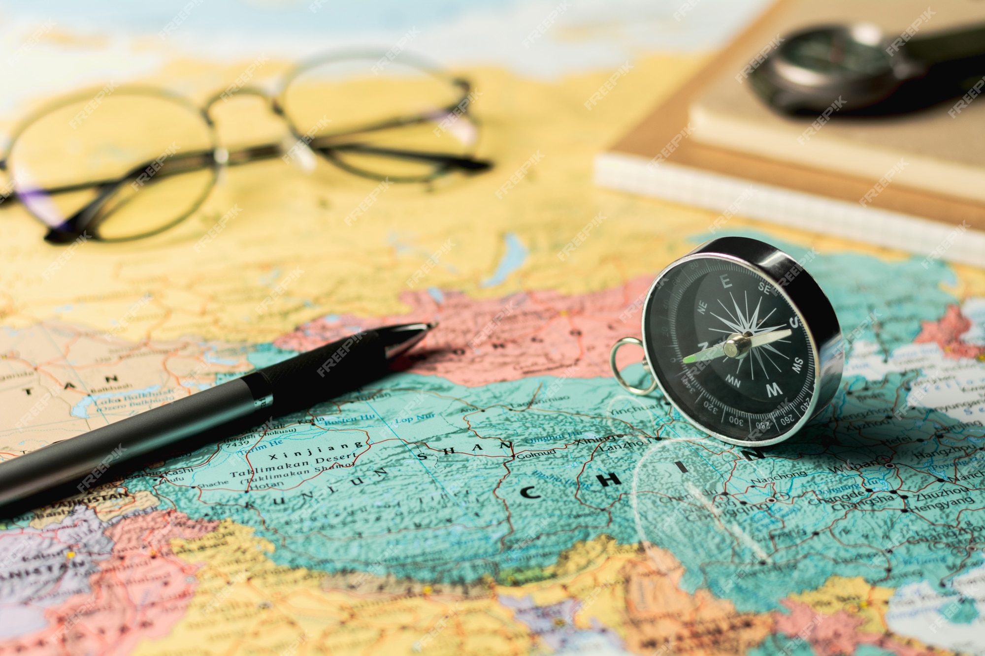 Premium Photo | Magnetic compass and stationary on map.