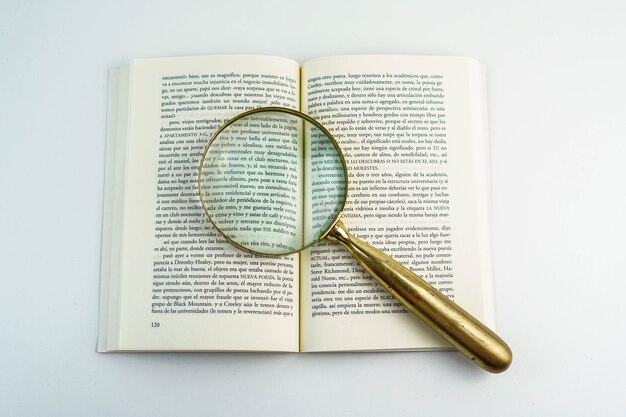 Premium Photo | A magnifying glass and a spanish book