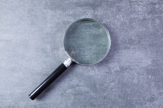 Premium Photo | Magnifying glass on the table