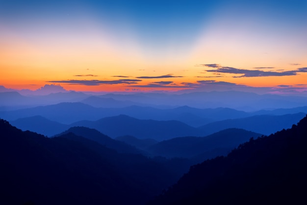 Premium Photo | Majestic mountains landscape in sunset sky with clouds ...