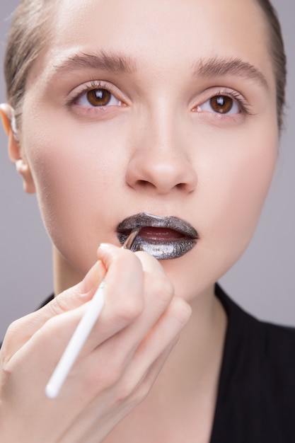 Download Free Makeup Artist Applies Black Lipstick Beautiful Woman Face Hand Use our free logo maker to create a logo and build your brand. Put your logo on business cards, promotional products, or your website for brand visibility.