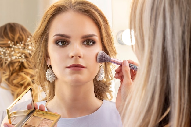 Download Free Makeup Artist Puts Makeup On Girl Model Premium Photo Use our free logo maker to create a logo and build your brand. Put your logo on business cards, promotional products, or your website for brand visibility.