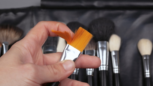Download Free Makeup Brush In The Hands Of A Makeup Artist Beauty Premium Photo Use our free logo maker to create a logo and build your brand. Put your logo on business cards, promotional products, or your website for brand visibility.