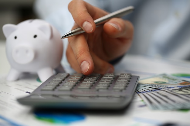 Premium Photo | Male accountant is counting salary in office