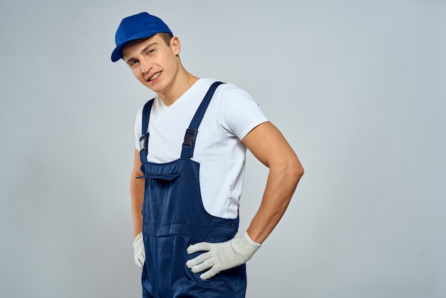 Premium Photo | Male builder in special clothes builder and call repair