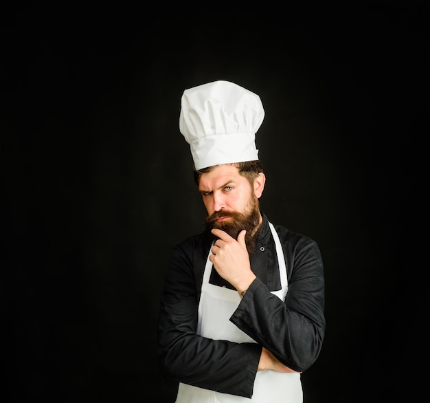 Premium Photo | Male chef cook or baker in uniform thinking what to ...