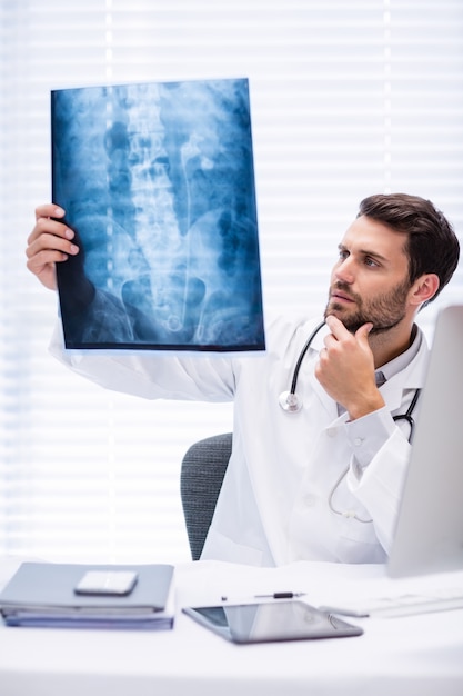 Premium Photo | Male doctor examining x-ray