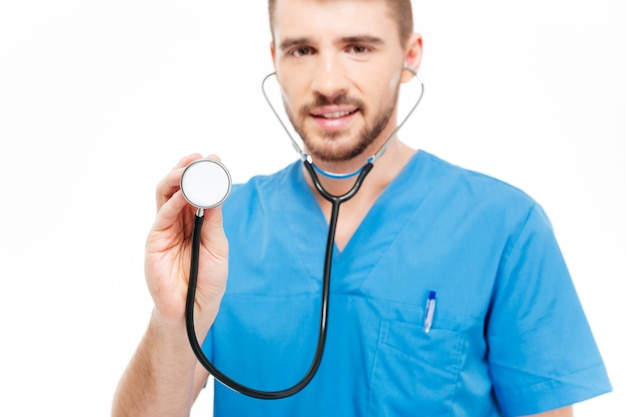 Premium Photo Male Doctor Holding Stethoscope Isolated On A White