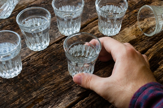 Premium Photo Male Hand Holding A Vodka Shot